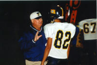 Coach Bonewald instructs Tony Ramirez