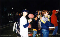 Manager James Matthews spins a football