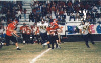 Greg Richter and Damian Gomez chase a bulldog