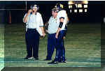 Coaches Pozzi and Bonewald consult with their quarterback