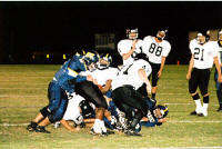 Anthony Weed tackles a Badger