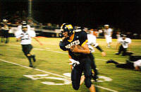 Sherman Posey runs along the sidelines