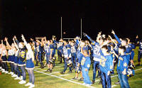 Cheerleaders and Pirates listen to the band!