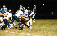 Adam Sekula and Daniel Dehoyos tackle runner