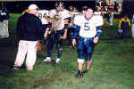 Anthony Weed exercises his ankle on the sidelines