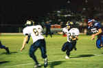 Bobby Joe  Serna runs behind Preston Matheaus