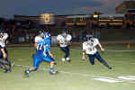 Bobby Joe Serna about to receive block from Willie Fluitt