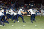 Johnny Hernandez blocks while Braden Boening hands off to Willie Fluitt