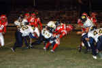 Jonathan Flores and Johnny Hernandez tackle runner