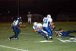 Dean Koehne and Jerry Alfaro tackle runner