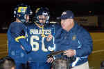 Coach Bonewald talks to Braden Boening and Devin Dziuk on the sidelines