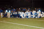 Pirates and Ro-Hawks pray after the game