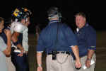 Pirate coaches (Selph and Bonewald) plan their strategy on the sidelines