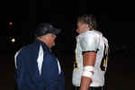 Coach Bonewald talks with Miles Stone on sidelines